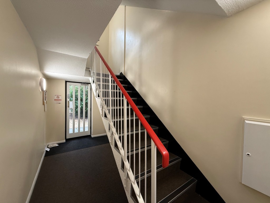 Lot: 146 - VACANT ONE-BEDROOM FIRST FLOOR FLAT FOR IMPROVEMENT - Communal entranceway with stairs to first floor level